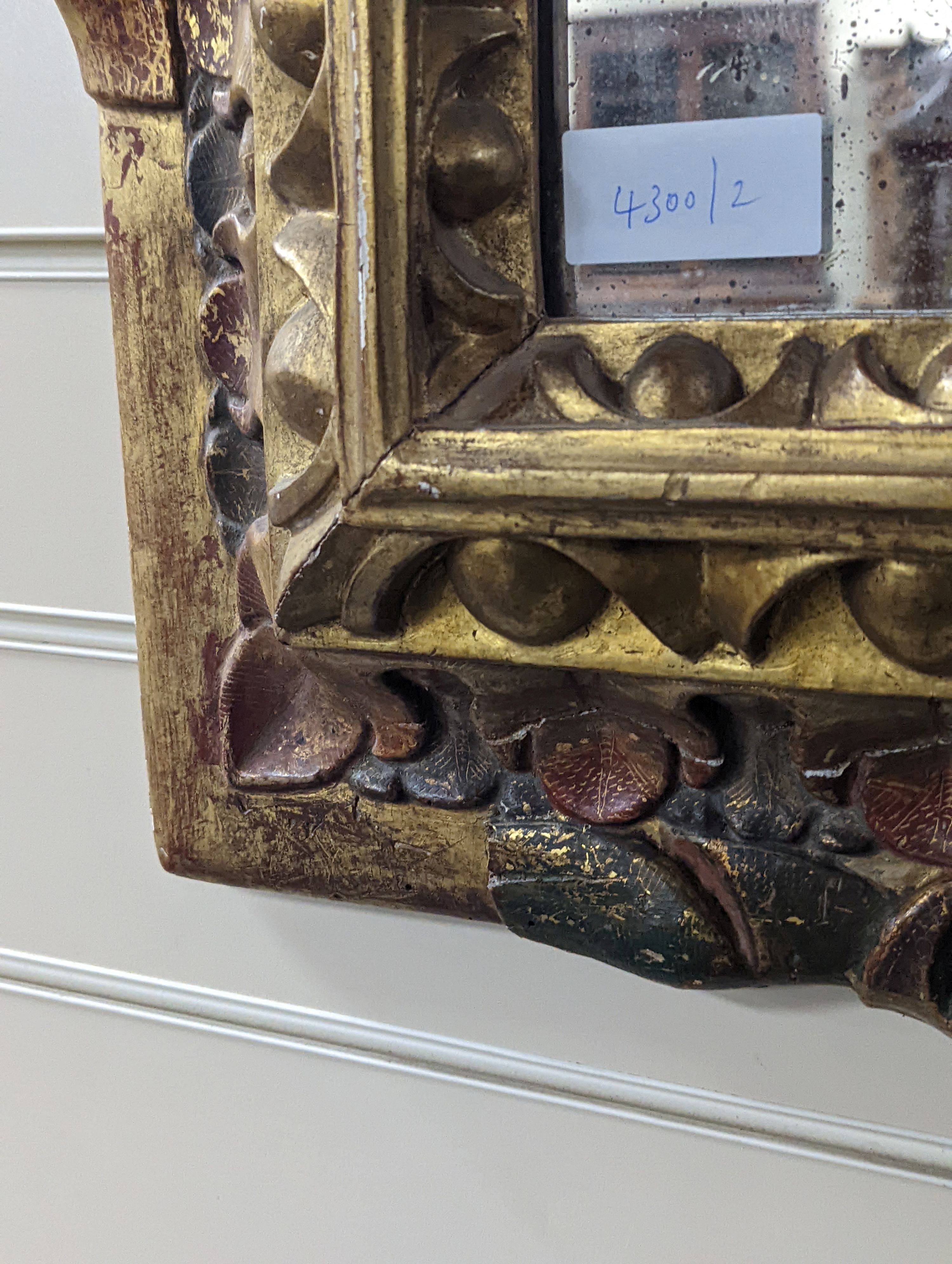 An 18th century painted Italian carved giltwood rectangular wall mirror, width 50cm, height 63cm